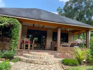 The Family Cottage veranda with steps up from the garden path.