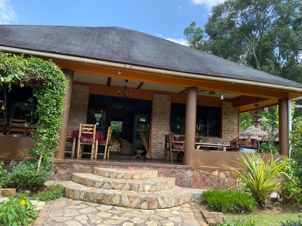 The Family Cottage veranda with steps up from the garden path.