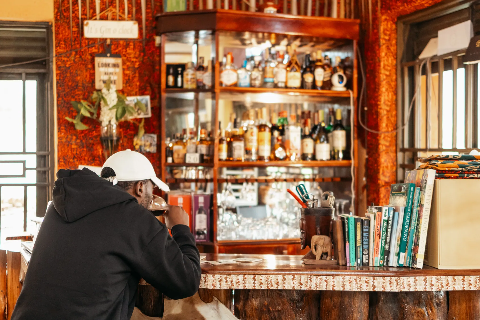 The Nyore bar with timber shelving and a selection of drinks.