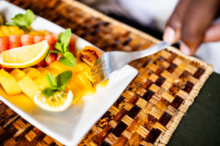 A freshly prepared meal served on a plate over a woven placemat.